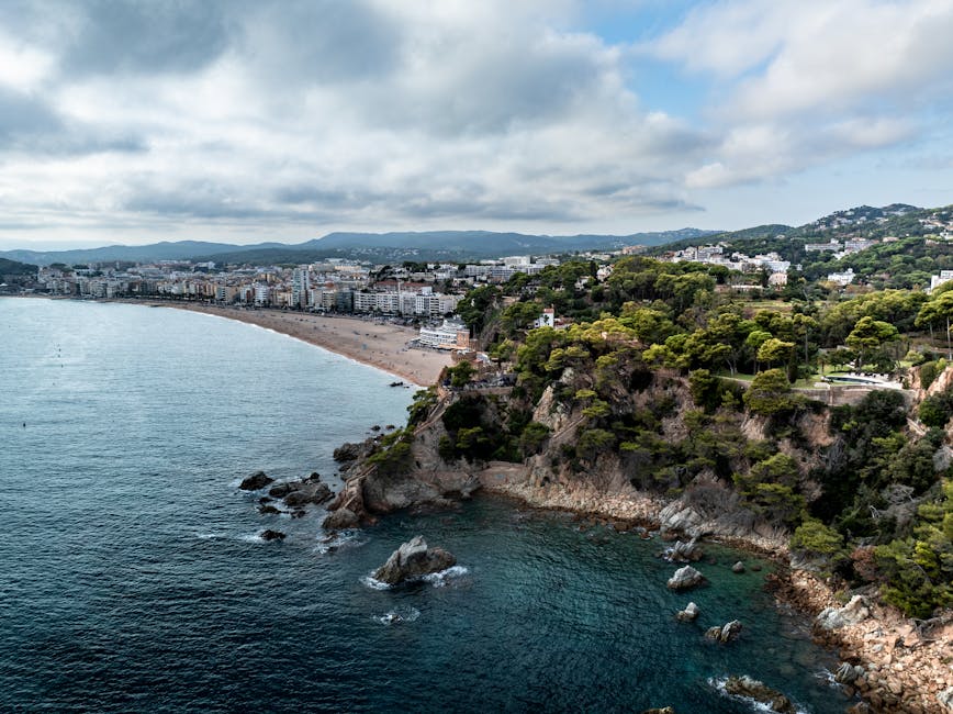 Discover the beautiful coastline of Lloret de Mar with its sandy beaches and lush greenery