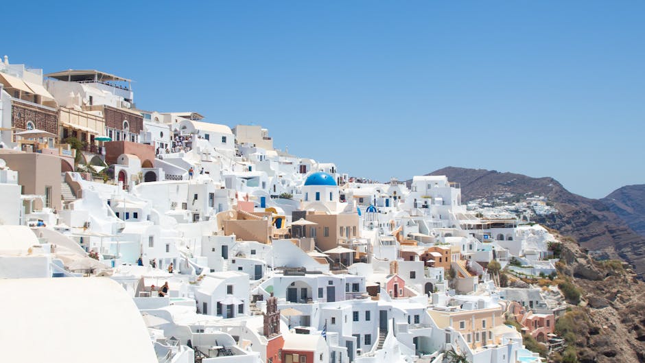 A captivating view of Santorini's iconic white buildings under a clear blue sky